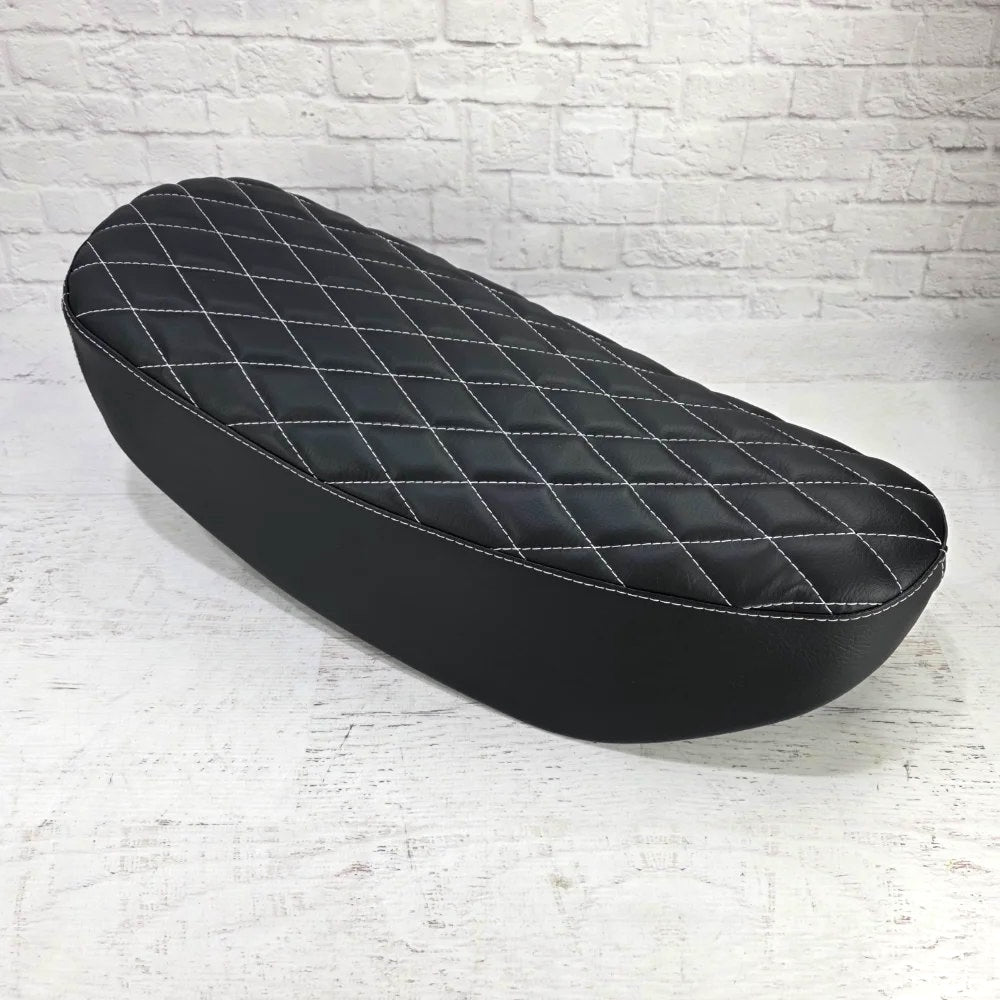Black diamond Honda DAX 125 seat cover with white stitching, handmade by Cheeky Seats