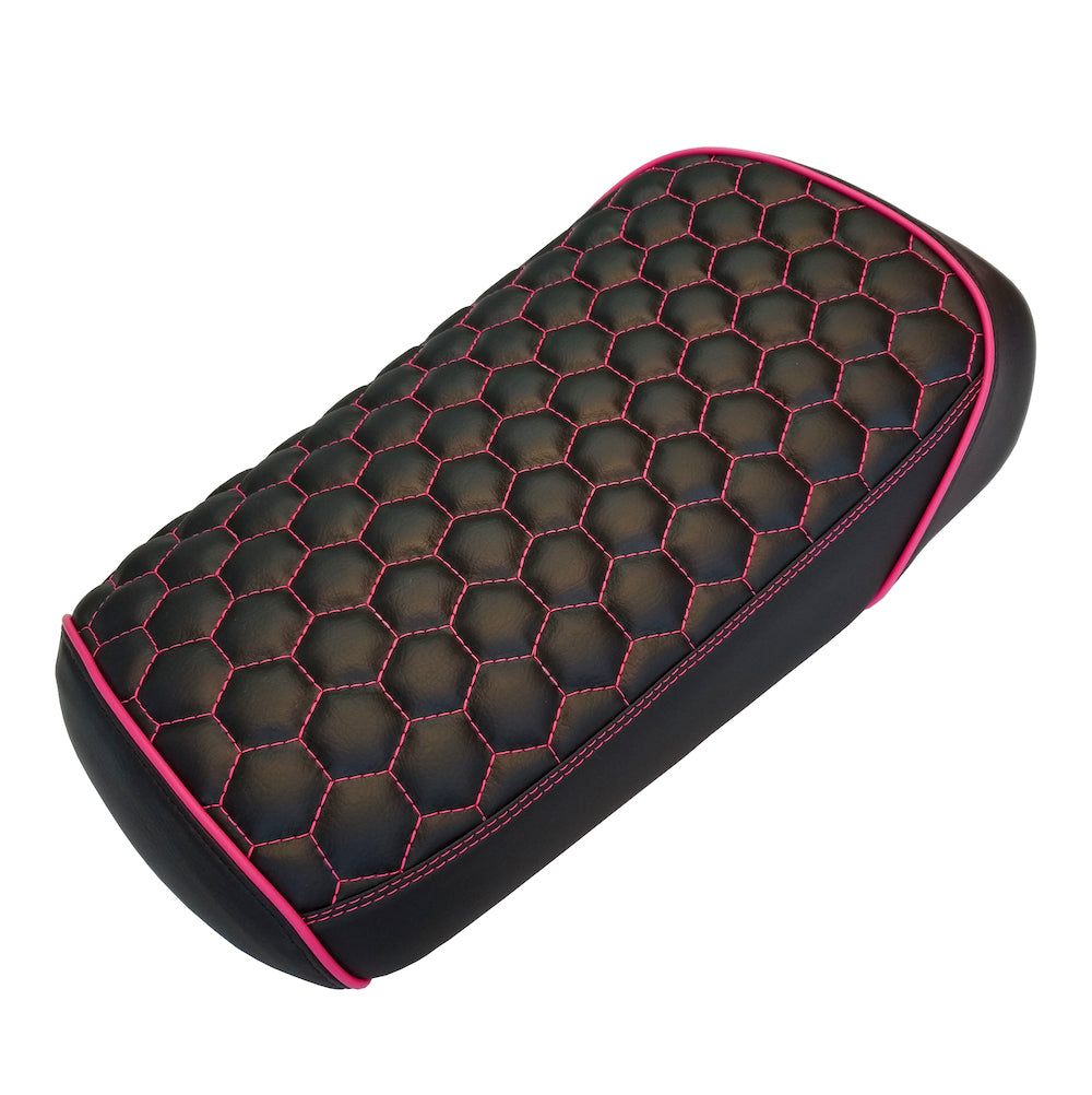 Black hexagon honeycomb seat cover with hot pink contrast stitching and pink piping against a white background, handmade by Cheeky Seats