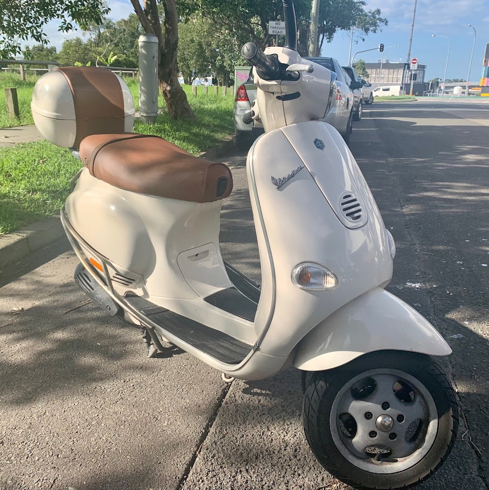 Vespa ET 2/4 matte cinnamon seat cover on scooter handmade by Cheeky Seats